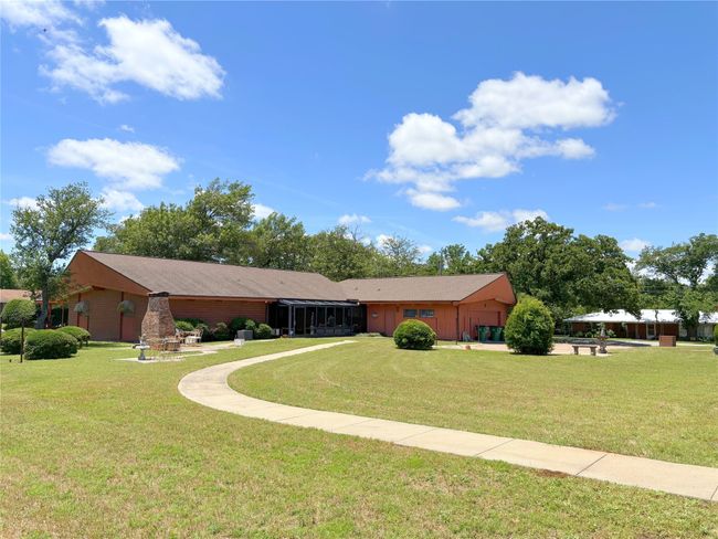 Single story home with an attached garage and a front lawn | Image 10