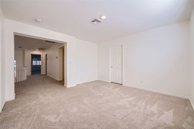 Unfurnished room with light colored carpet, visible vents, and baseboards | Image 44
