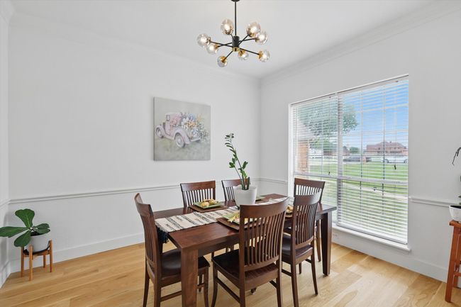 Spacious formal dining room facing front of home. | Image 8