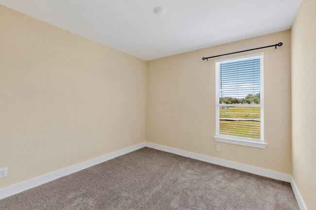 Carpeted spare room with baseboards | Image 24