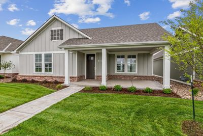 View of front facade with a porch and a front lawn | Image 1