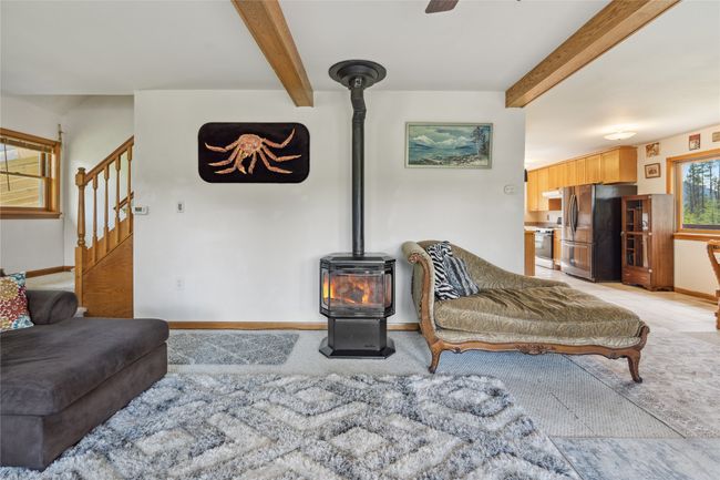 Main level living room, Stairs to access upstairs | Image 34