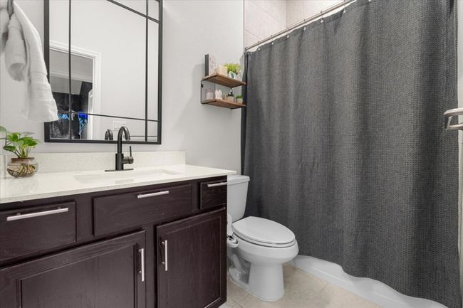Bathroom featuring toilet, tile patterned floors, and vanity | Image 28