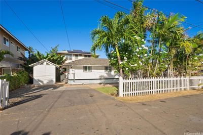 Charming home complete with a white picket fence and parking for 2-3 vehicles. | Image 2