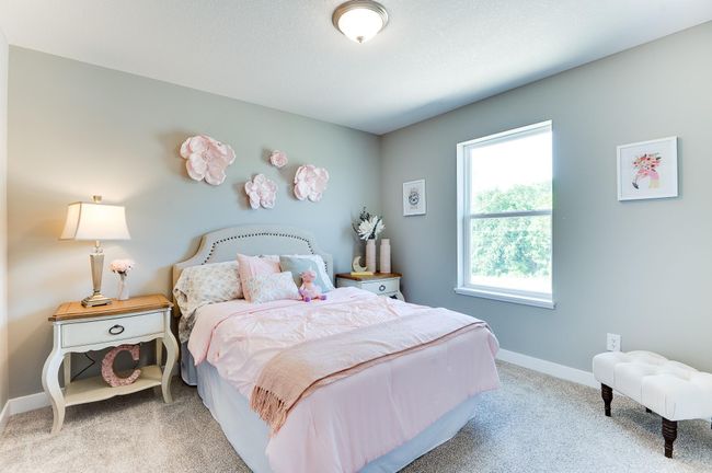 The home's upper level also features a pair of secondary bedrooms, each located just steps from an adjacent full bathroom! Photo of model home, color and options will vary. | Image 33