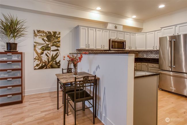 Eating area w/ granite bar | Image 4
