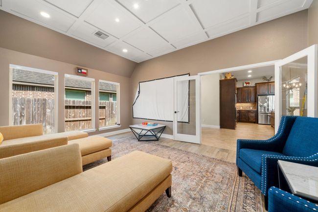 The alternate view of this room showcases the location right off the living room and kitchen with so many possibilities for this room! Game room, media, formal living, the options are endless! | Image 20