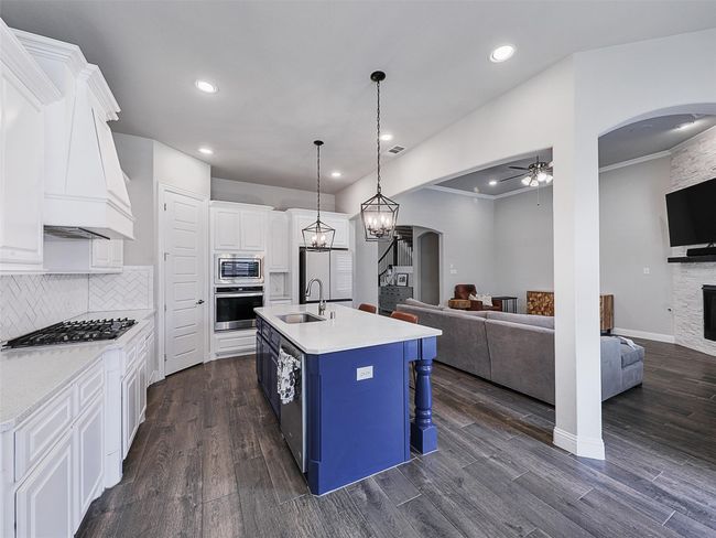 Kitchen is open to the family room | Image 12