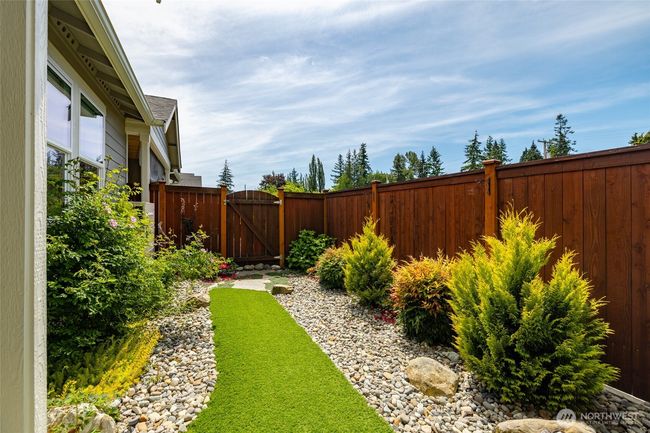 The seller put in pet turf and rocks for a beautiful yard low maintenance. | Image 30