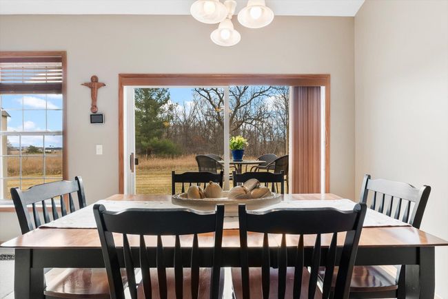 Comfortable dining space ideal for gatherings, with beautiful sightlines to both the backyard and living room. | Image 17