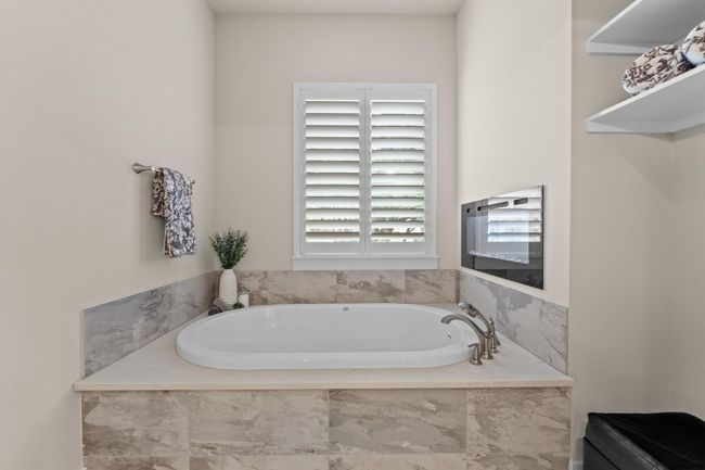 Bathroom featuring a bath | Image 20
