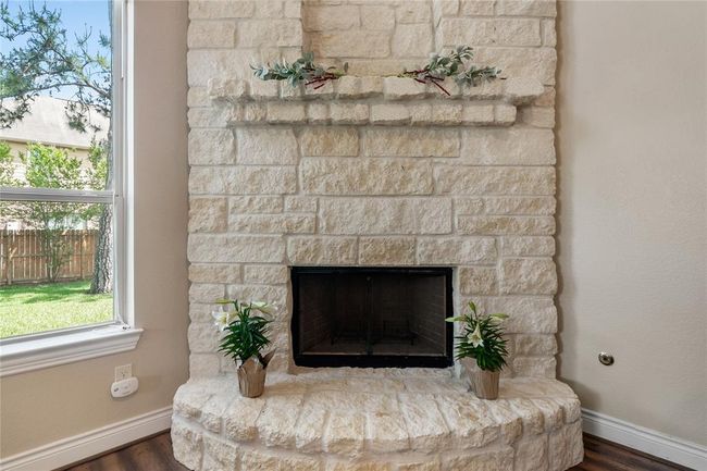 The marvelous fireplace brings a cozy and relaxing atmosphere to your gatherings. | Image 17