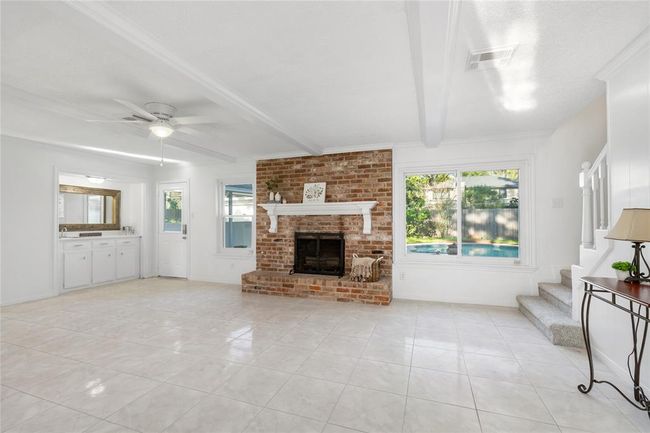 Living area boost a wood burning fireplace, new paint and fixtures | Image 11
