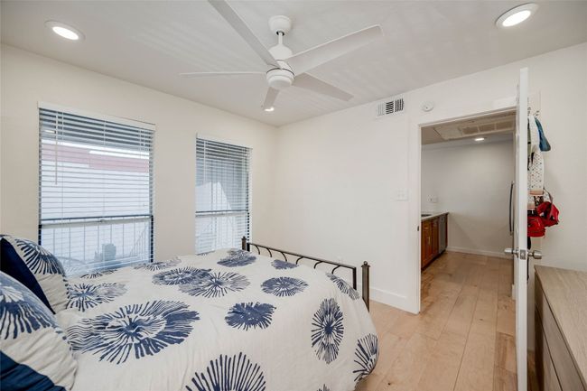 Bedroom featuring recessed lighting, light wood-style flooring, attic access, and a ceiling fan | Image 14