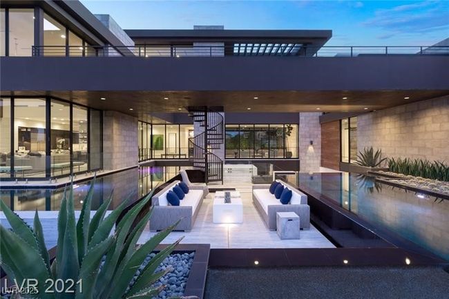 Rear view of house featuring an outdoor hangout area, stairs, and a patio | Image 49