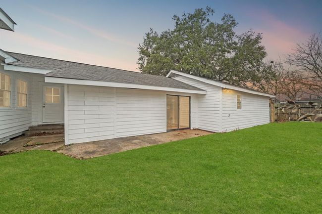 Virtually Staged: Welcome to your new backyard! Check out all of that wonderful green space for the kids and pets to run around in, and a fantastic patio perfect for entertaining family, friends, and guests. | Image 17