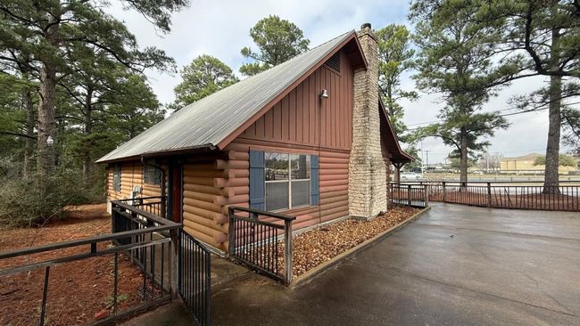 View of outdoor structure with fence | Image 8