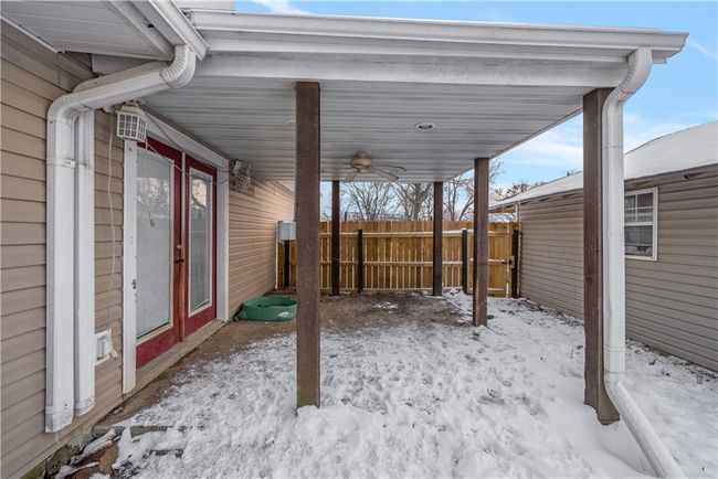 Snow covered patio with ceiling fan | Image 49