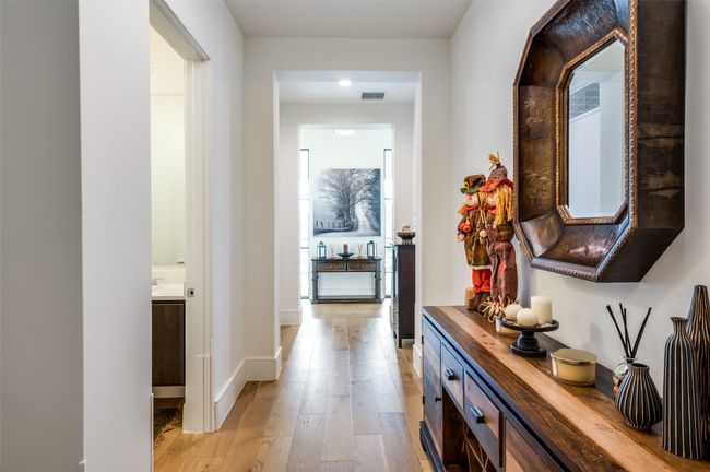 Welcoming entry and foyer lined with pretty light wood floors | Image 4