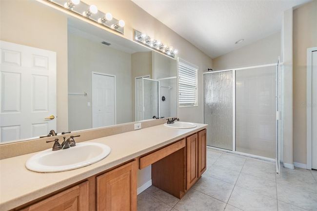 Oversized vanity for additional storage and a step-in shower | Image 14