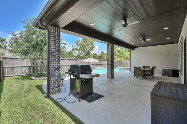 Pre-plumbed for outdoor kitchen. Another view of Massive back patio. | Image 30
