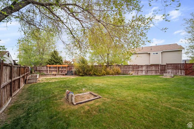 View of yard with a garden and a fenced backyard | Image 32