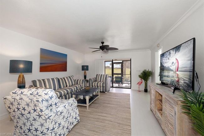 Living room featuring ceiling fan | Image 13