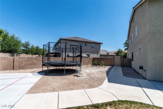 View of patio / terrace featuring a fenced backyard and a trampoline | Image 44