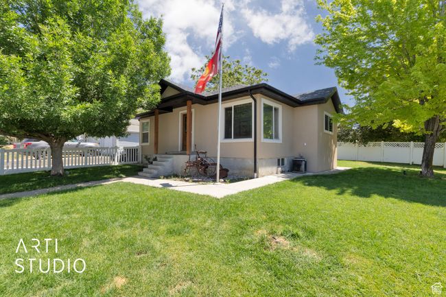 View of front of home featuring stucco siding and central air condition unit | Image 30