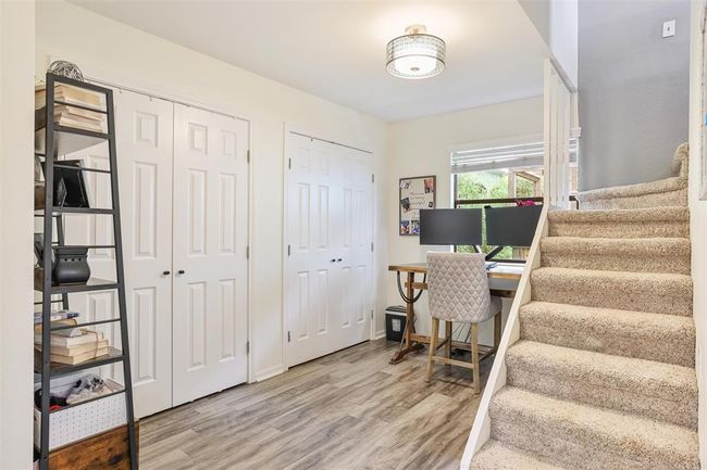 A cozy nook off the kitchen and primary bedroom perfect for a home office. | Image 26