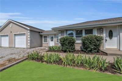 Single story home featuring a garage and a front lawn | Image 3