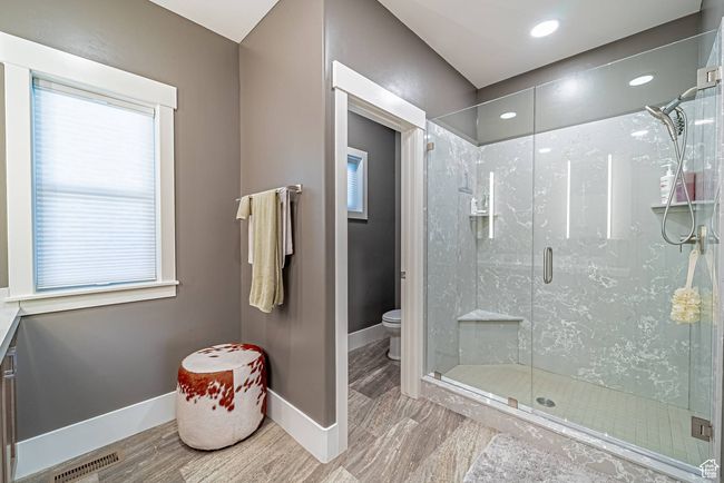 Primary bathroom with baseboards, a shower stall, and recessed lighting | Image 8