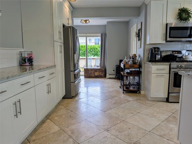 View from kitchen area to backyard | Image 11