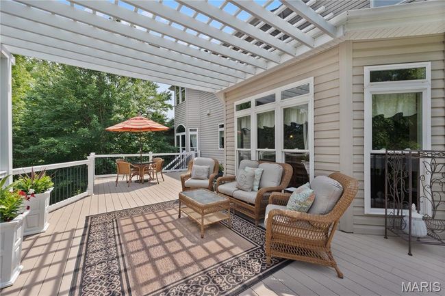 Deck with outdoor dining space, a pergola, and outdoor lounge area | Image 64
