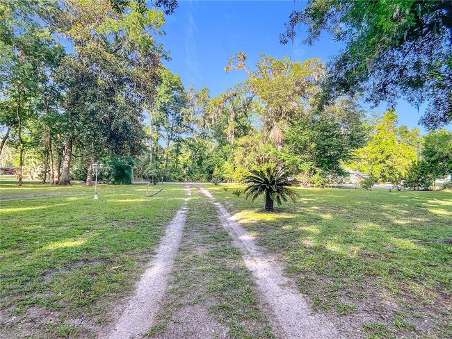 Driveway from house towards road view | Image 48