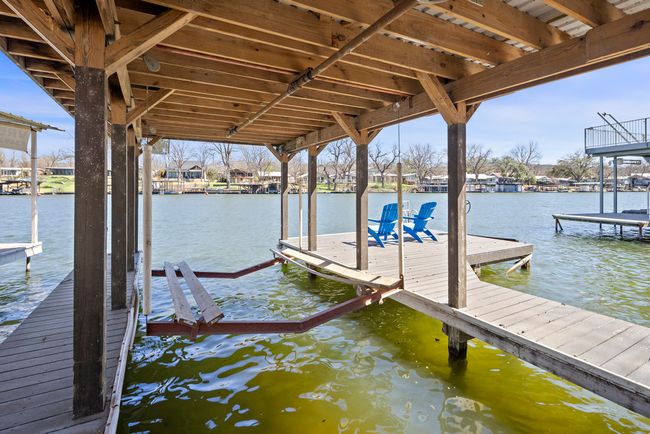 Dock area with a water view and boat lift | Image 21