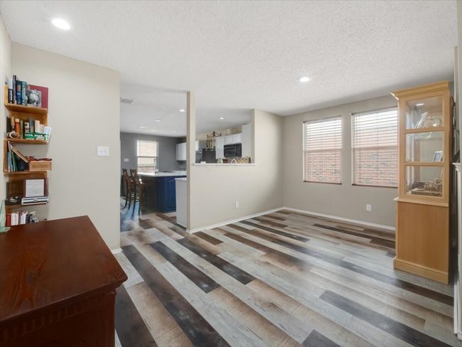 Living room with a textured ceiling and hardwood / wood-style floors | Image 7