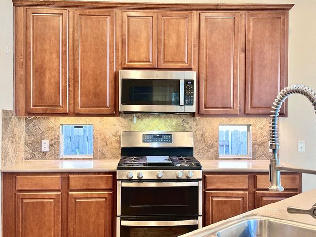 Double oven and gas stove with griddle. | Image 12