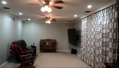 Living area with carpet, ceiling fan, and crown molding | Image 3