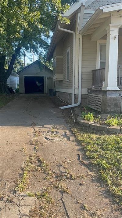 View of side of property with a garage | Image 3