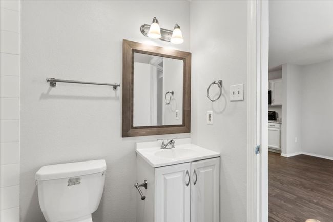 Bathroom with vanity, mirror easily accessible for guest for resident | Image 21
