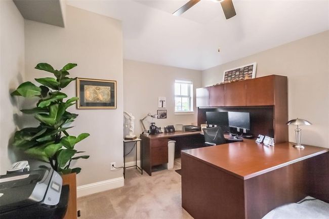 The largest of the three upstairs bedrooms which is currently being used as a home office. | Image 30