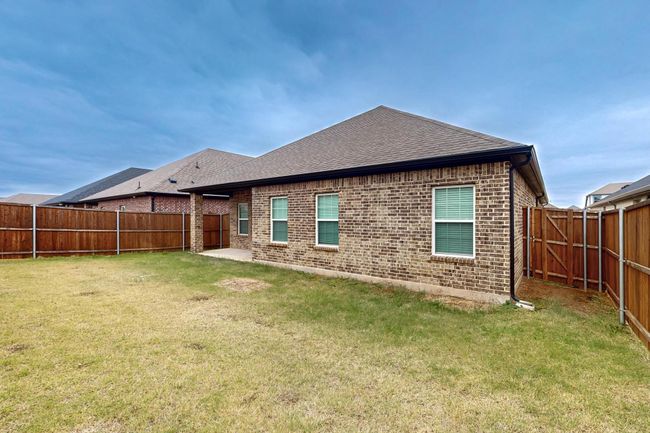 Rear view of property with a lawn | Image 24