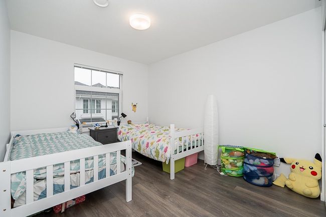 Bedroom with wood finished floors | Image 23