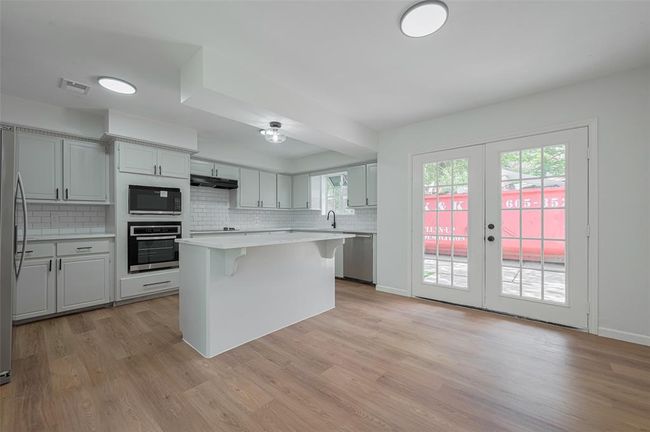 Kitchen with new counter tops and cabinets. | Image 12
