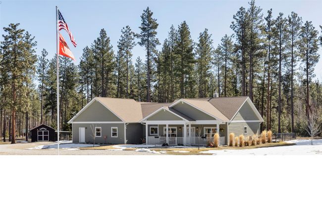 Craftsman inspired home with a porch and an outdoor structure | Image 55