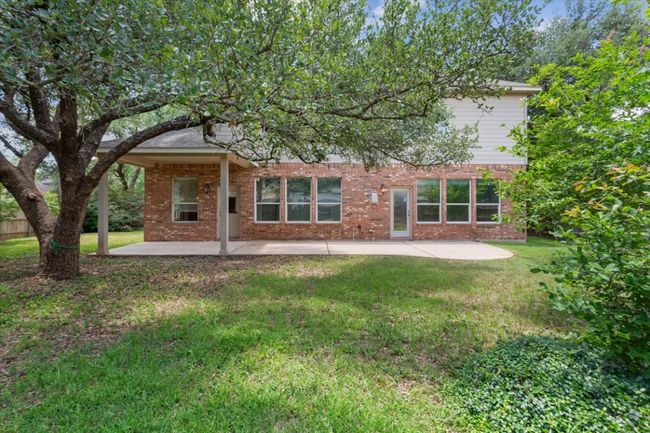 Rear view of property with a patio, brick siding, and a yard | Image 38