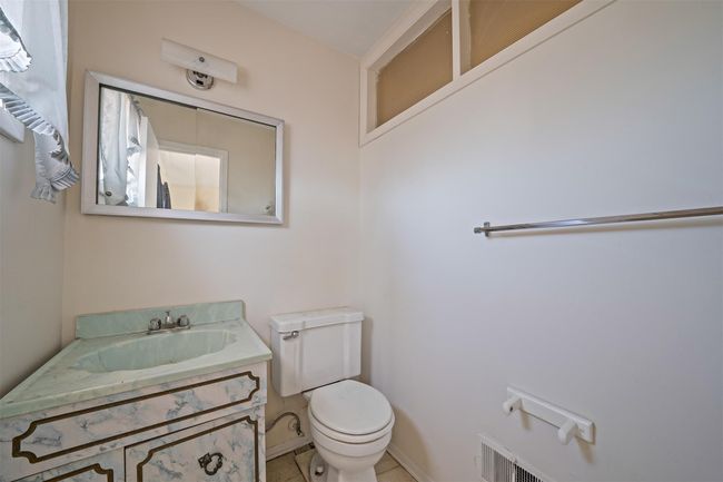 Half bath featuring visible vents, vanity, and toilet | Image 20