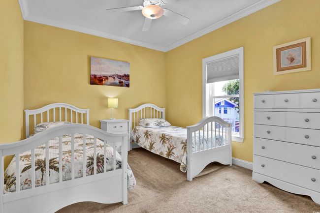 Carpeted bedroom with crown molding and ceiling fan | Image 14