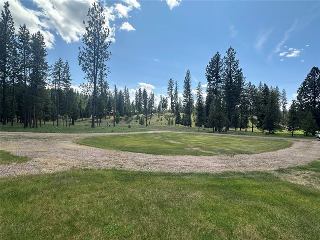 Home sits off the road: Circular driveway for easy in and out! | Image 44